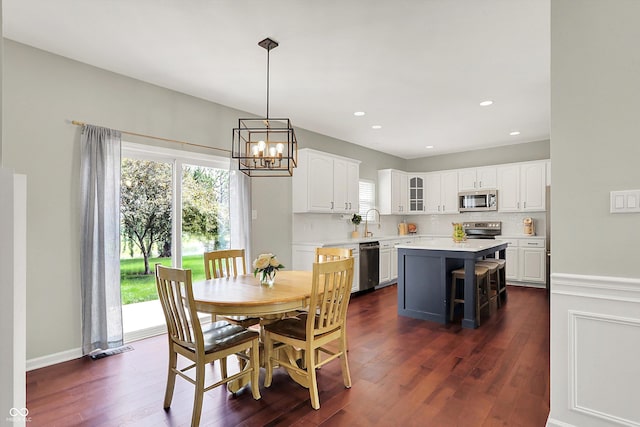 13191 Roma, Carmel, IN 46074 - dining room featuring dark wood-style floors, a chandelier, and recessed lighting