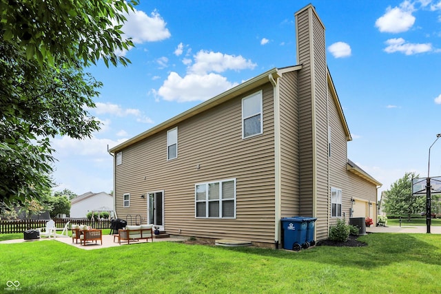 13191 Roma, Carmel, IN 46074 - rear view of property featuring a chimney, an outdoor living space, a garage, and a patio area