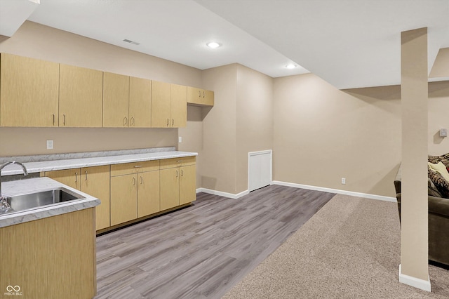 13191 Roma, Carmel, IN 46074 - kitchen with light brown cabinetry, light countertops, light wood finished floors, and recessed lighting