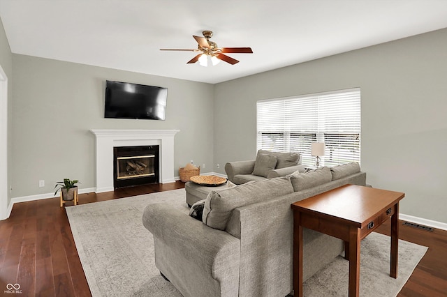 13191 Roma, Carmel, IN 46074 - living area with ceiling fan, a glass covered fireplace, and dark wood finished floors