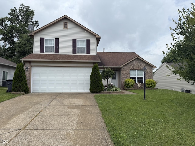 982 Ramsgate Rd, Greenwood, IN 46143 - traditional home featuring concrete driveway, a garage, a front yard, brick siding, and a shingled roof