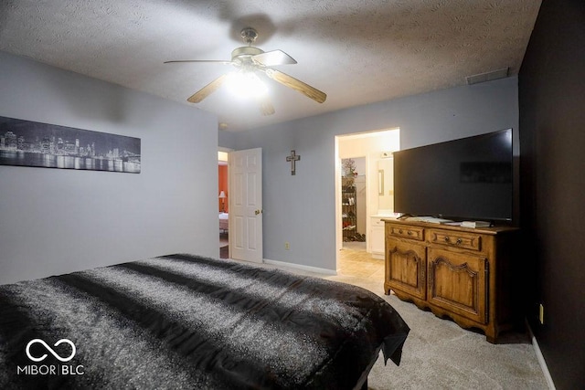 982 Ramsgate Rd, Greenwood, IN 46143 - bedroom featuring light carpet, ceiling fan, ensuite bath, and a textured ceiling