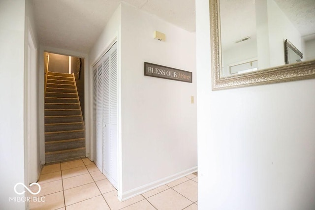 982 Ramsgate Rd, Greenwood, IN 46143 - corridor with stairway and light tile patterned floors