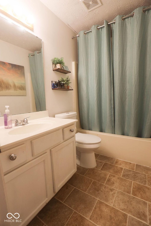 982 Ramsgate Rd, Greenwood, IN 46143 - bathroom with vanity, shower / bath combo with shower curtain, and a textured ceiling