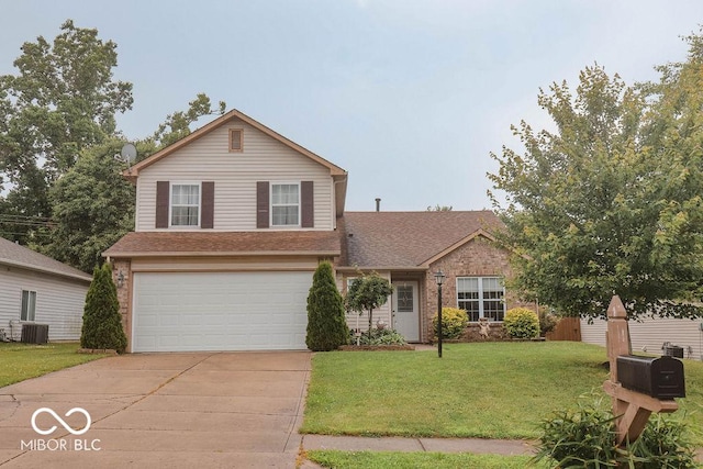 982 Ramsgate Rd, Greenwood, IN 46143 - traditional-style house featuring a garage, driveway, a front lawn, and roof with shingles