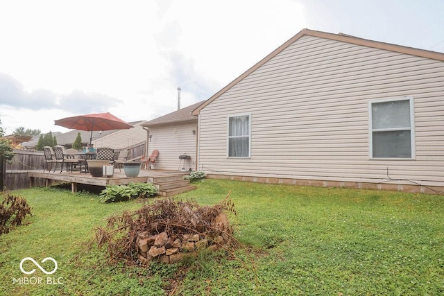 982 Ramsgate Rd, Greenwood, IN 46143 - rear view of property featuring a fire pit, a deck, and a yard