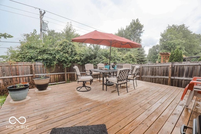 982 Ramsgate Rd, Greenwood, IN 46143 - wooden terrace featuring outdoor dining space and a fenced backyard