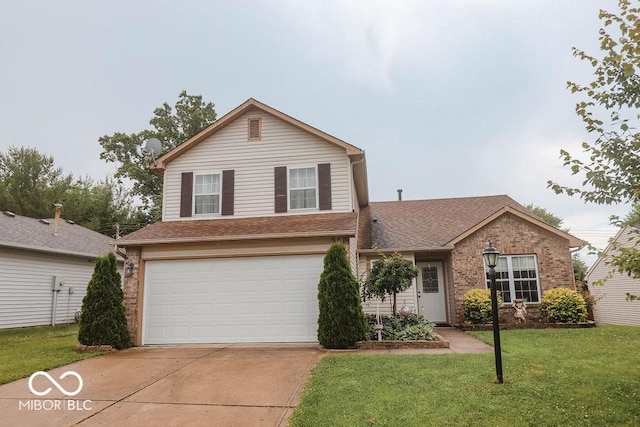 982 Ramsgate Rd, Greenwood, IN 46143 - traditional-style home featuring an attached garage, driveway, a front lawn, brick siding, and a shingled roof