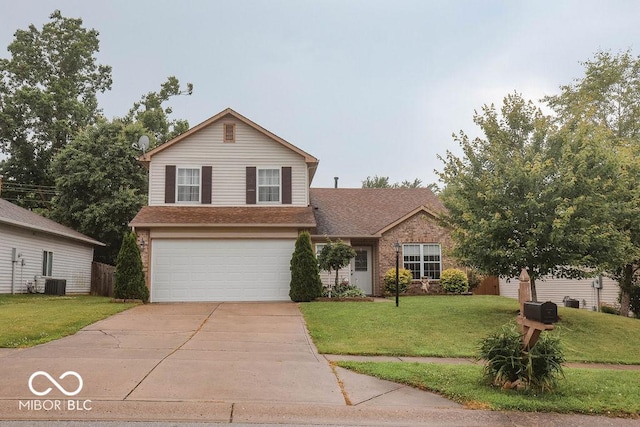 982 Ramsgate Rd, Greenwood, IN 46143 - traditional-style home featuring concrete driveway, an attached garage, a front yard, brick siding, and a shingled roof