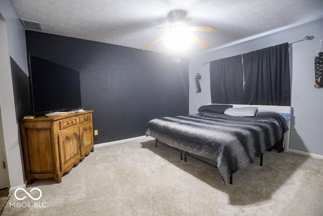 982 Ramsgate Rd, Greenwood, IN 46143 - bedroom with light carpet, ceiling fan, and a textured ceiling