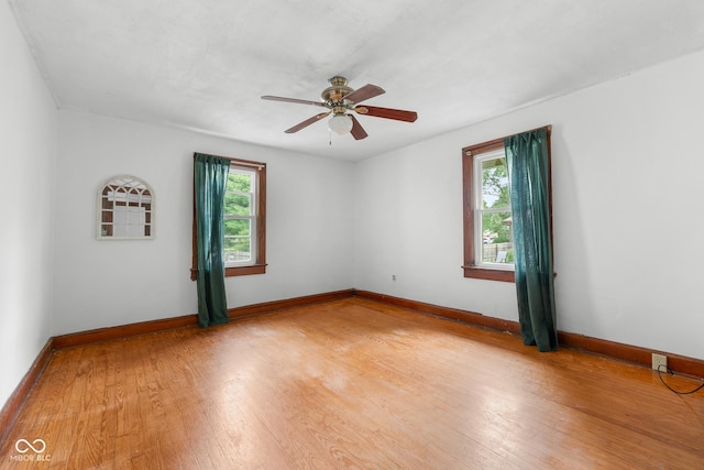 2211 S Andrews Rd, Yorktown, IN 47396 - unfurnished room featuring plenty of natural light, a ceiling fan, and light wood-style flooring