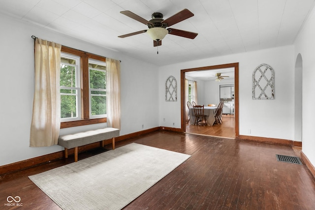2211 S Andrews Rd, Yorktown, IN 47396 - unfurnished room with arched walkways, ceiling fan, and hardwood / wood-style flooring