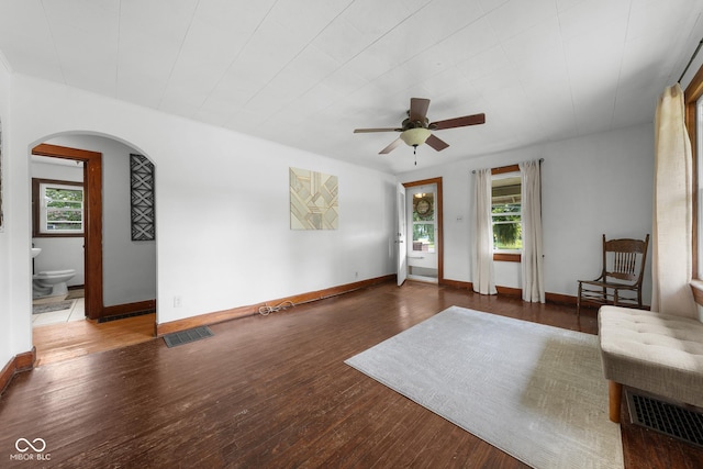 2211 S Andrews Rd, Yorktown, IN 47396 - unfurnished room featuring arched walkways, plenty of natural light, a ceiling fan, and wood finished floors