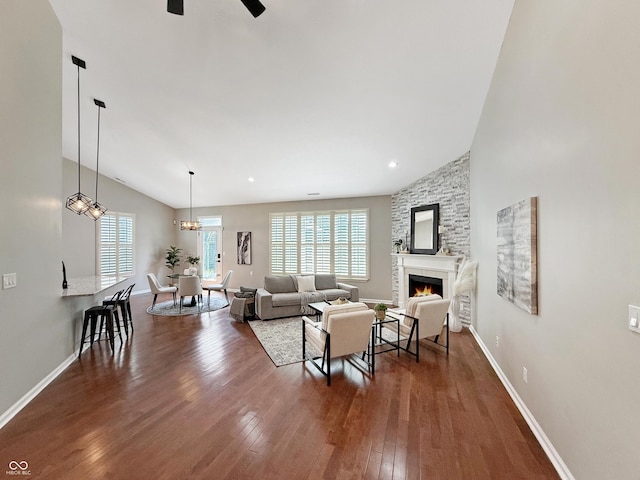 9302 N Bayland Dr, Mccordsville, IN 46055 - living area featuring dark wood-style flooring, ceiling fan, and a fireplace