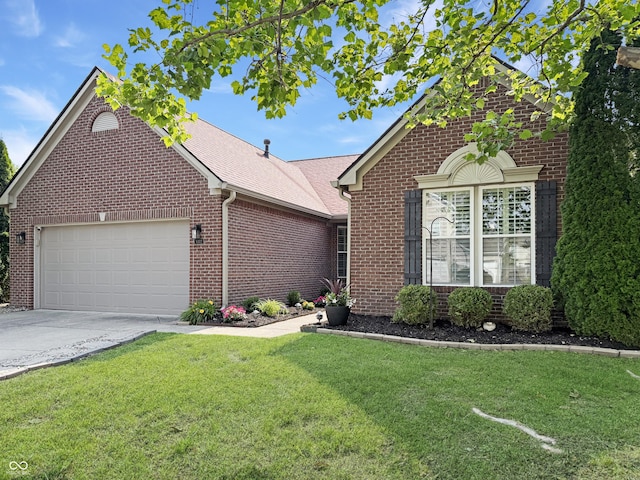 9302 N Bayland Dr, Mccordsville, IN 46055 - view of front of house with brick siding, an attached garage, a front yard, and concrete driveway
