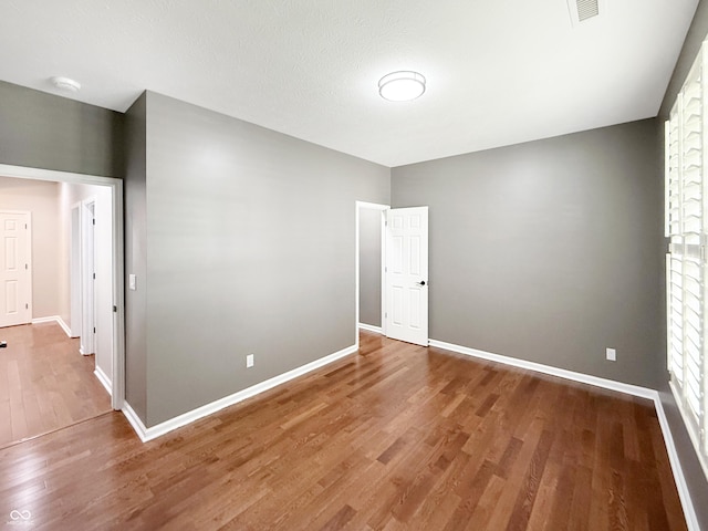 9302 N Bayland Dr, Mccordsville, IN 46055 - empty room featuring wood finished floors and a smoke detector