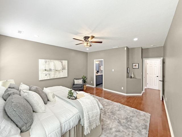 9302 N Bayland Dr, Mccordsville, IN 46055 - bedroom with wood finished floors, recessed lighting, ceiling fan, and ensuite bathroom