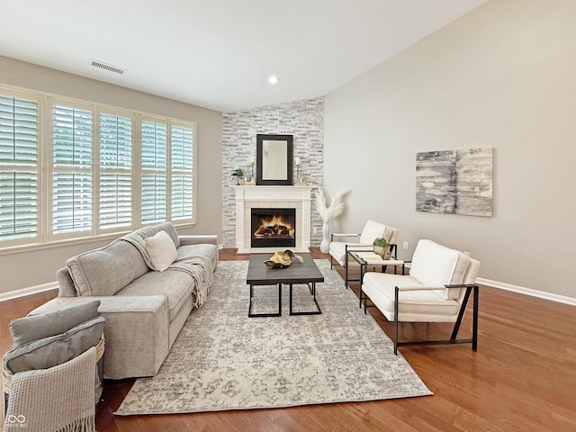 9302 N Bayland Dr, Mccordsville, IN 46055 - living area featuring lofted ceiling, wood finished floors, and a fireplace