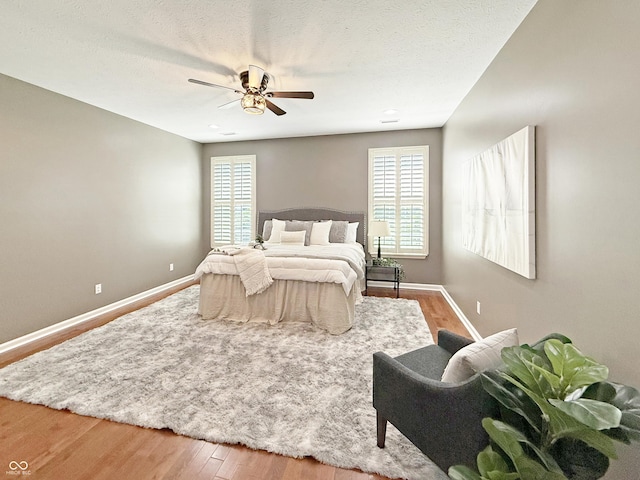 9302 N Bayland Dr, Mccordsville, IN 46055 - bedroom featuring multiple windows, wood finished floors, and ceiling fan