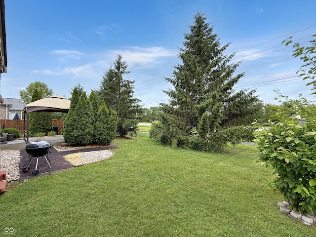 9302 N Bayland Dr, Mccordsville, IN 46055 - view of grassy yard featuring a gazebo and a patio area
