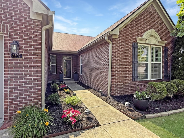 9302 N Bayland Dr, Mccordsville, IN 46055 - entrance to property featuring brick siding and a shingled roof