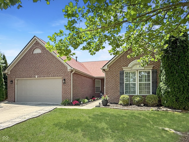 9302 N Bayland Dr, Mccordsville, IN 46055 - view of front of house featuring brick siding, an attached garage, concrete driveway, and a front yard
