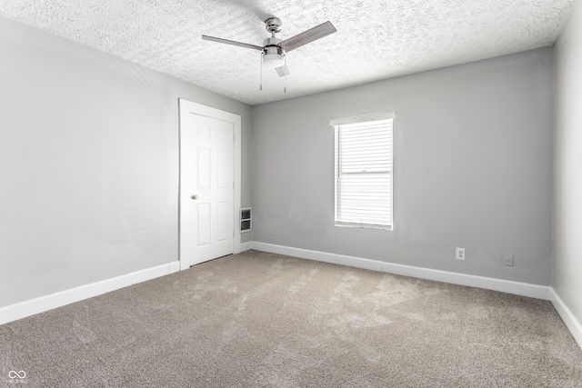 3045 Ruckle St, Indianapolis, IN 46205 - carpeted spare room with ceiling fan and a textured ceiling