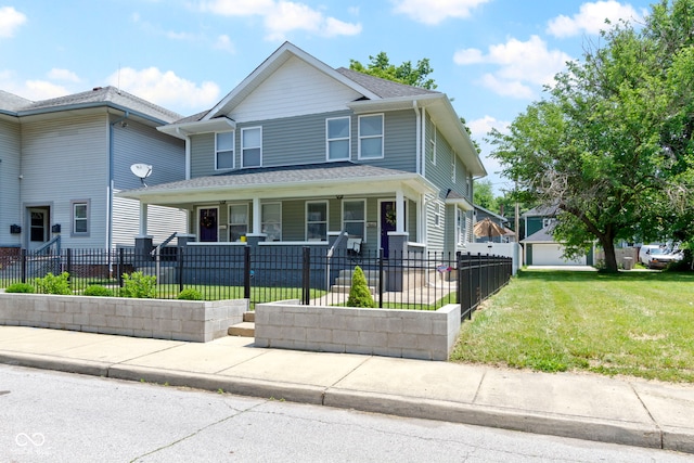 3045 Ruckle St, Indianapolis, IN 46205 - view of front of property with covered porch and a fenced front yard