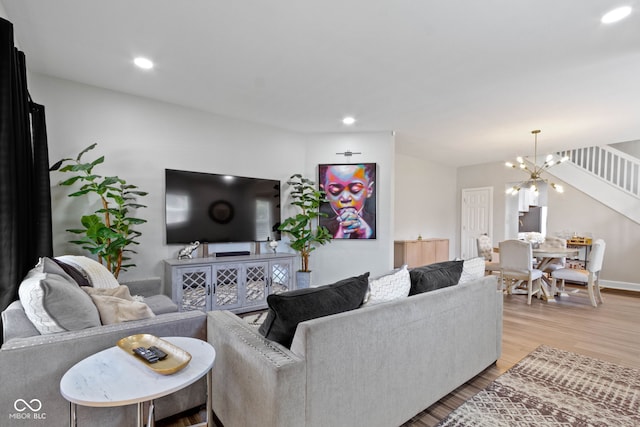 3045 Ruckle St, Indianapolis, IN 46205 - living room featuring light wood-style floors, a chandelier, and recessed lighting