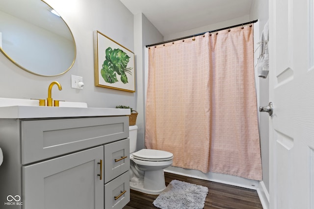 3045 Ruckle St, Indianapolis, IN 46205 - full bathroom featuring wood finished floors, vanity, and shower / bathtub combination with curtain