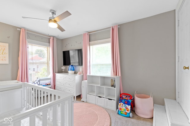 3045 Ruckle St, Indianapolis, IN 46205 - bedroom featuring a crib and a ceiling fan
