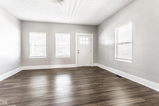 3045 Ruckle St, Indianapolis, IN 46205 - entryway with a textured ceiling and dark wood finished floors