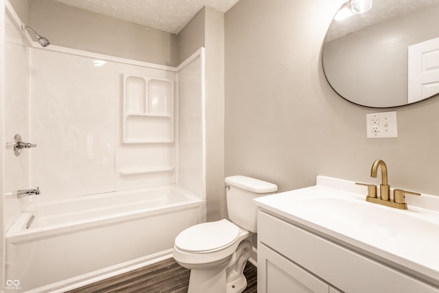 3045 Ruckle St, Indianapolis, IN 46205 - bathroom featuring a textured ceiling, vanity,  shower combination, and wood finished floors