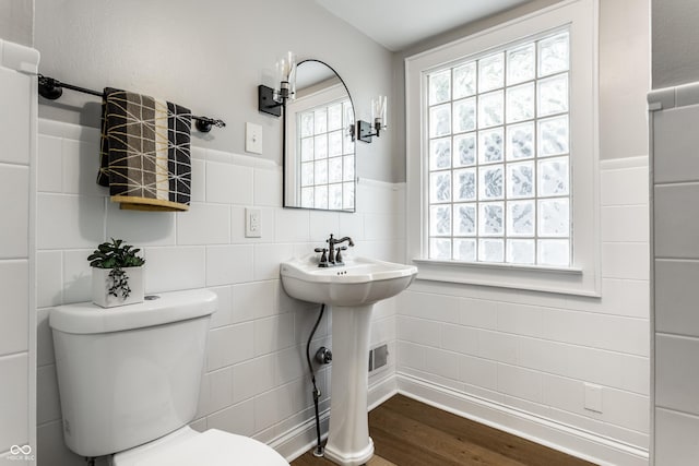 5760 Central Ave N, Indianapolis, IN 46220 - bathroom with tile walls, wood finished floors, and wainscoting