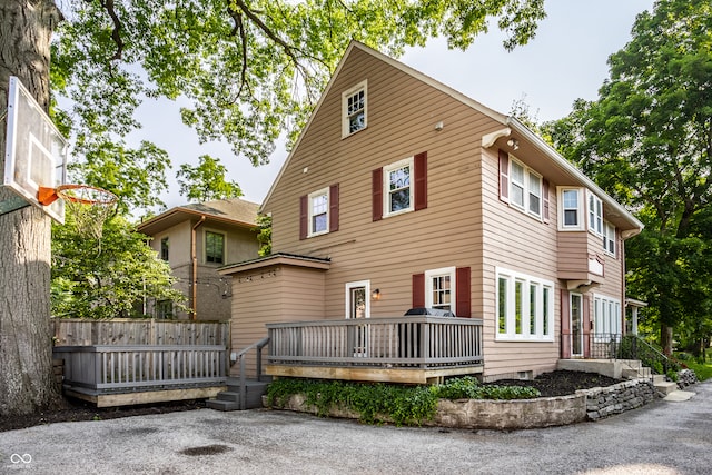 5760 Central Ave N, Indianapolis, IN 46220 - back of property with a wooden deck