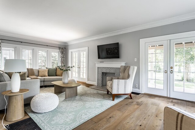 5760 Central Ave N, Indianapolis, IN 46220 - living area with french doors, ornamental molding, wood finished floors, and plenty of natural light