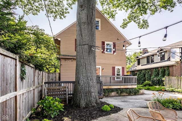 5760 Central Ave N, Indianapolis, IN 46220 - back of property with a fenced backyard, a patio area, and a deck