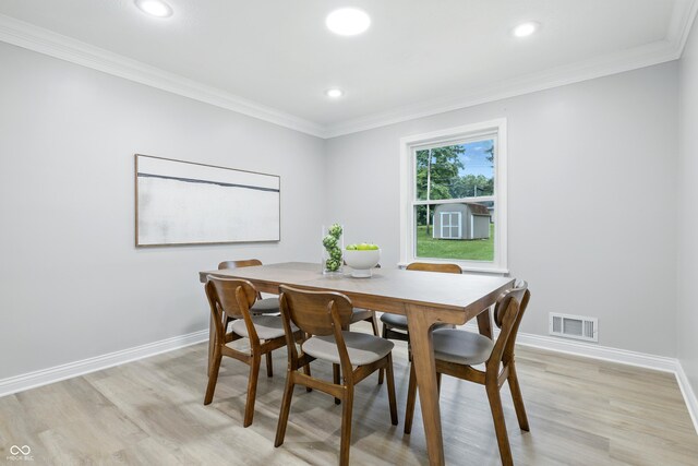5205 Staughton Dr, Indianapolis, IN 46226 - dining space with light wood-style floors, crown molding, and recessed lighting
