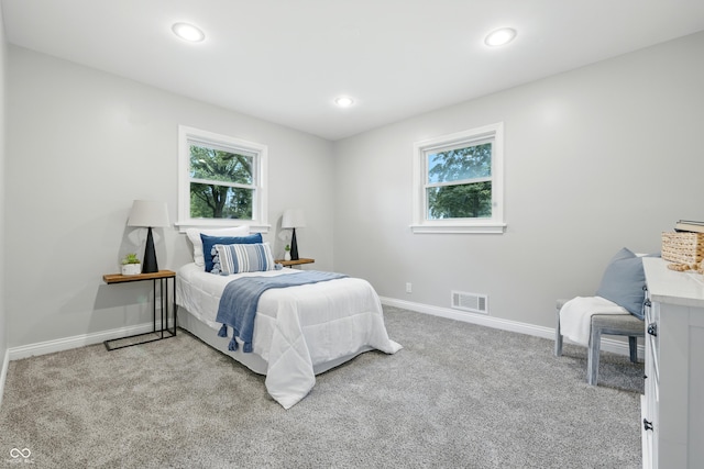 5205 Staughton Dr, Indianapolis, IN 46226 - carpeted bedroom featuring multiple windows and recessed lighting