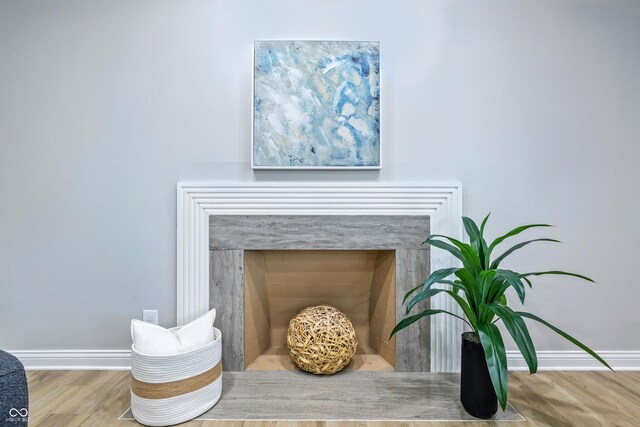 5205 Staughton Dr, Indianapolis, IN 46226 - detailed view of wood finished floors and a fireplace with flush hearth