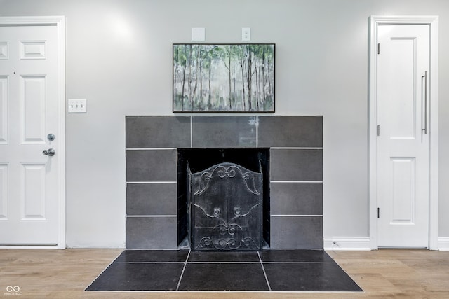 5205 Staughton Dr, Indianapolis, IN 46226 - detailed view of a tiled fireplace and wood finished floors