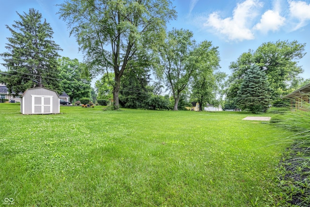 5205 Staughton Dr, Indianapolis, IN 46226 - view of grassy yard with a shed