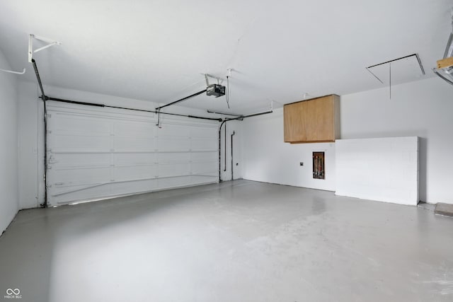 5205 Staughton Dr, Indianapolis, IN 46226 - garage featuring a garage door opener