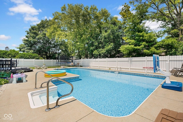 2384 Fairfax Dr, Columbus, IN 47203 - view of pool with a fenced backyard, a patio area, and a trampoline