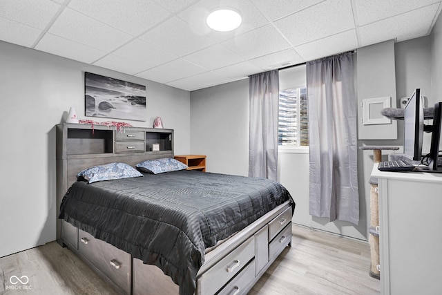 2384 Fairfax Dr, Columbus, IN 47203 - bedroom with light wood-type flooring and a paneled ceiling