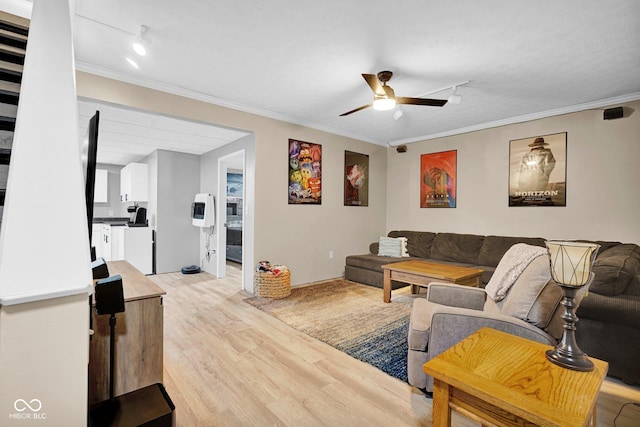 2384 Fairfax Dr, Columbus, IN 47203 - living area featuring light wood finished floors, crown molding, and a ceiling fan