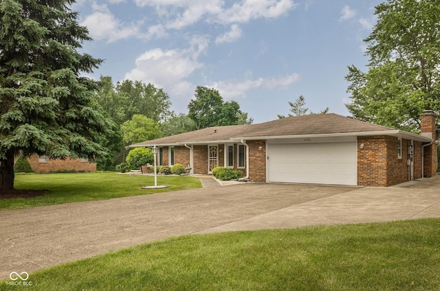 5749 Teresa Dr, Alexandria, IN 46001 - ranch-style house with concrete driveway, an attached garage, a front yard, a chimney, and brick siding