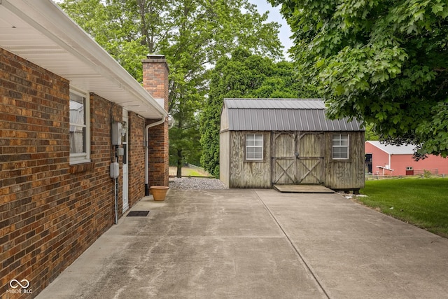 5749 Teresa Dr, Alexandria, IN 46001 - view of patio featuring a storage shed