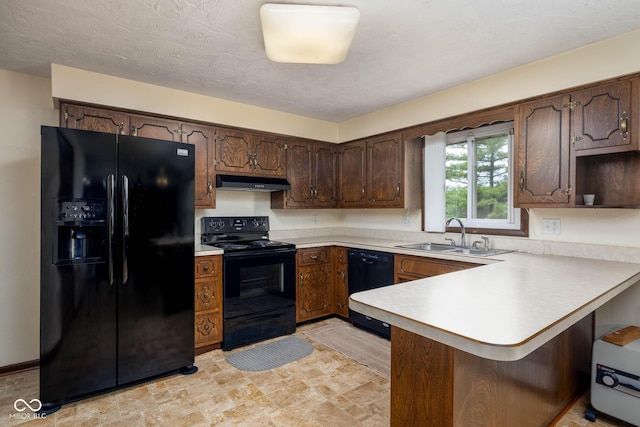 5749 Teresa Dr, Alexandria, IN 46001 - kitchen with black appliances, a peninsula, under cabinet range hood, light countertops, and a kitchen bar