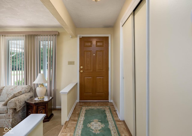 5749 Teresa Dr, Alexandria, IN 46001 - foyer entrance featuring baseboards and a textured ceiling